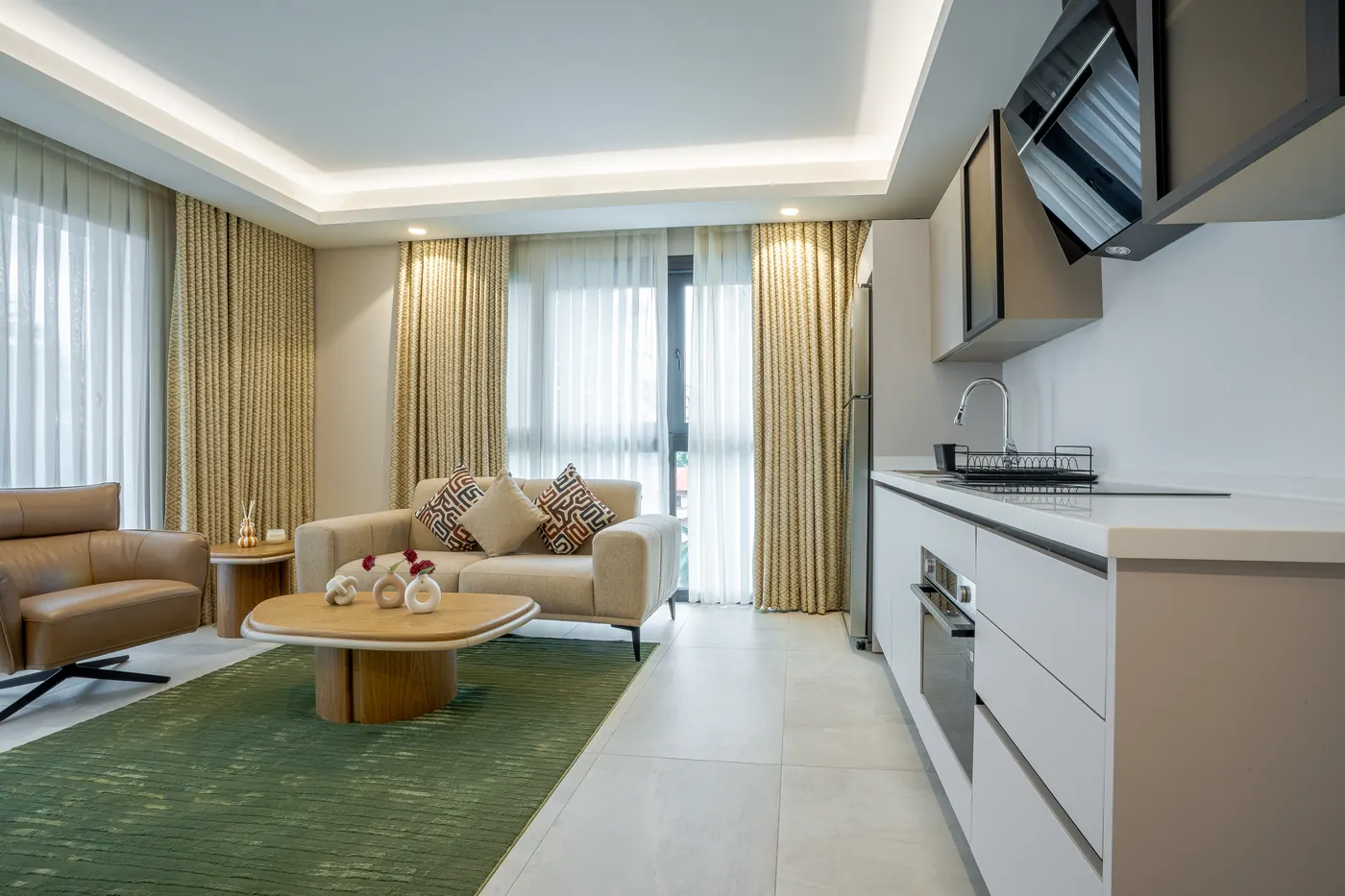 Living and dining area of a completed three-bedroom apartment at Grand Mirage