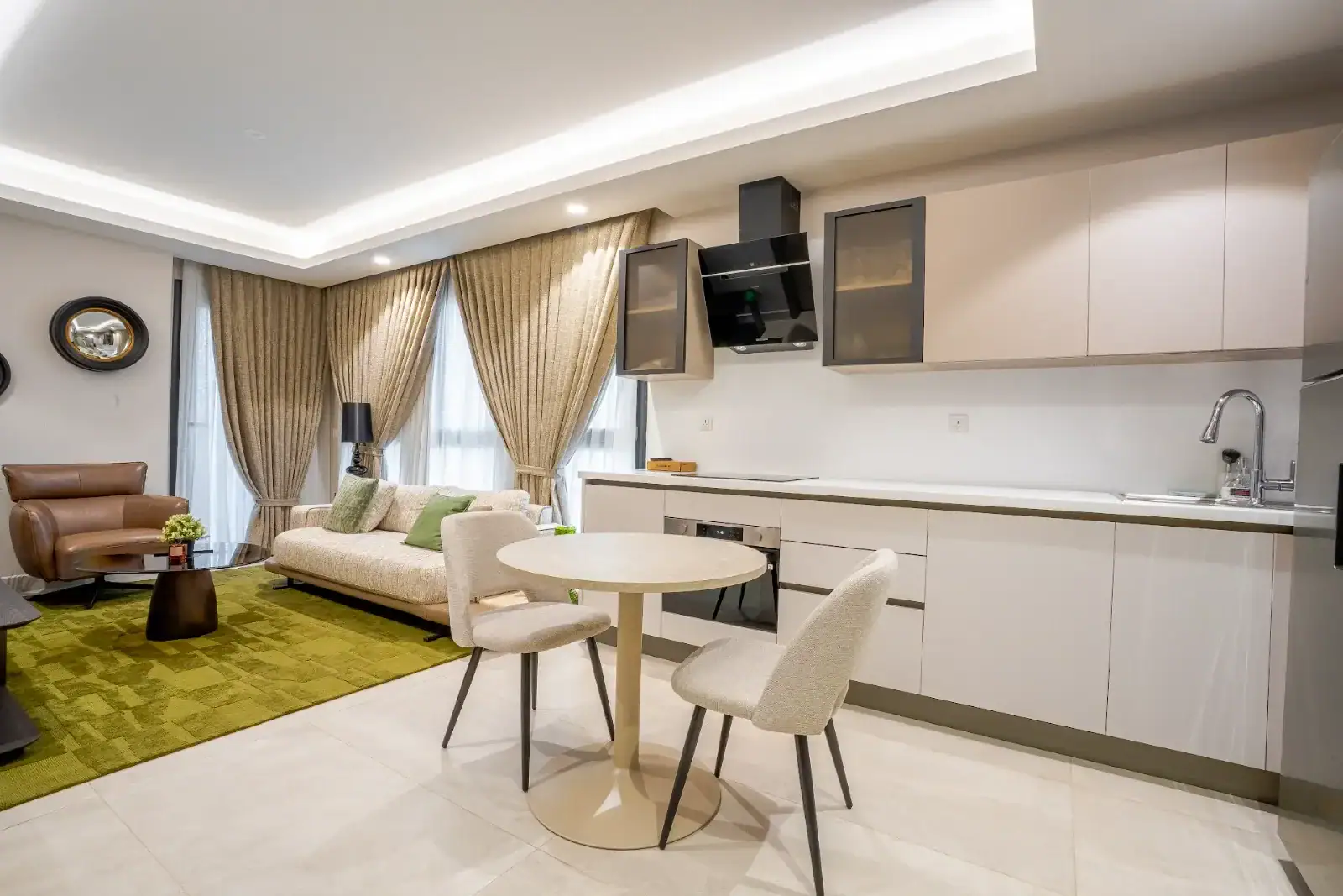 Open-plan kitchen and living area at Grand Mirage, Airport Residential